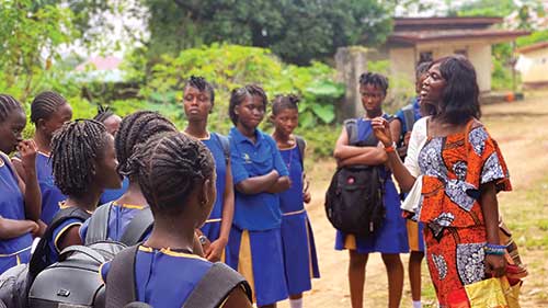 Women teaching a bunch of students