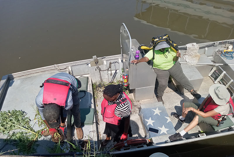 Grace Nalugwa in a boat with others