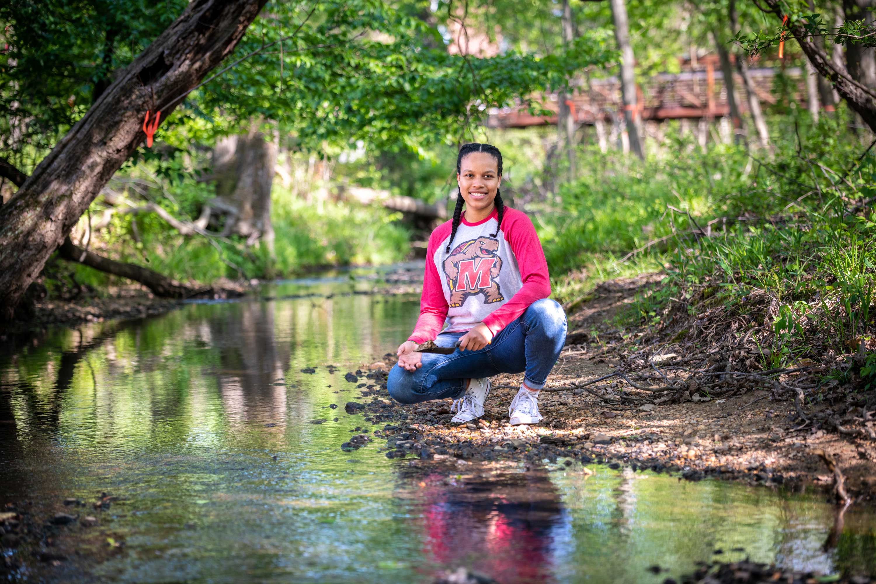 Student by a stream