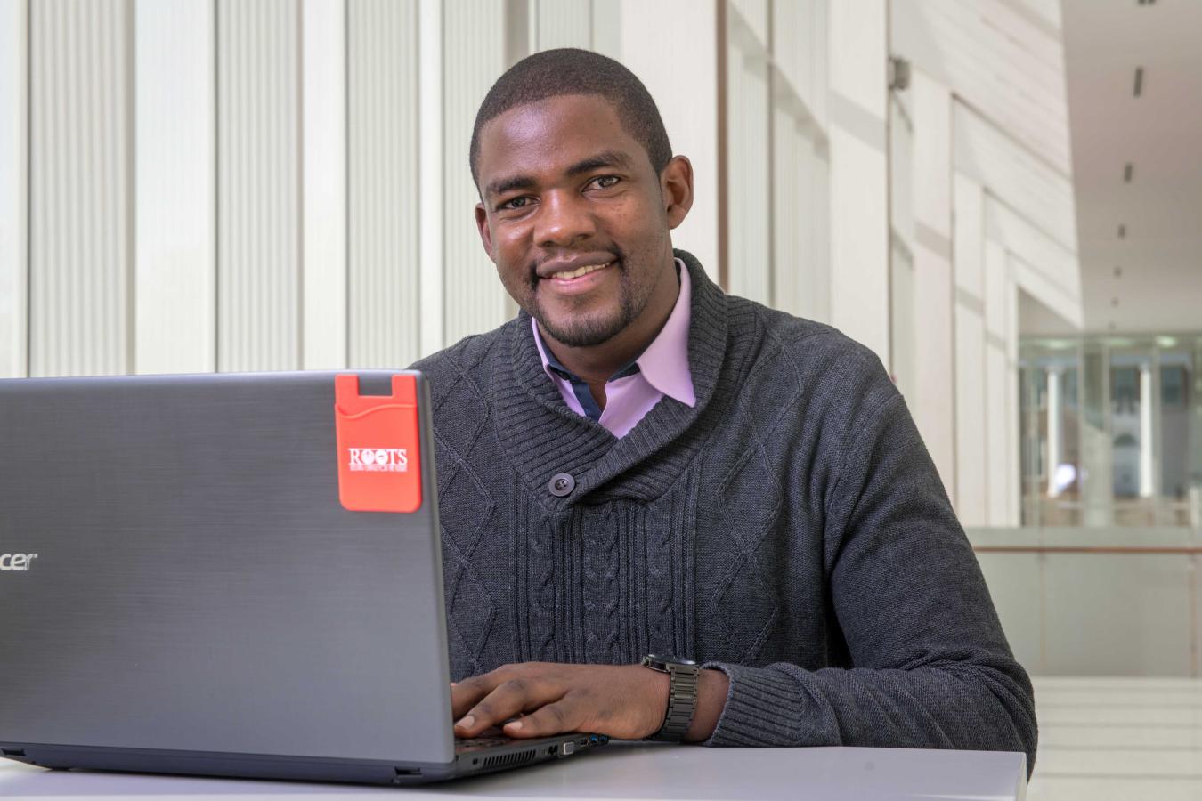 Student sitting in front of their computer