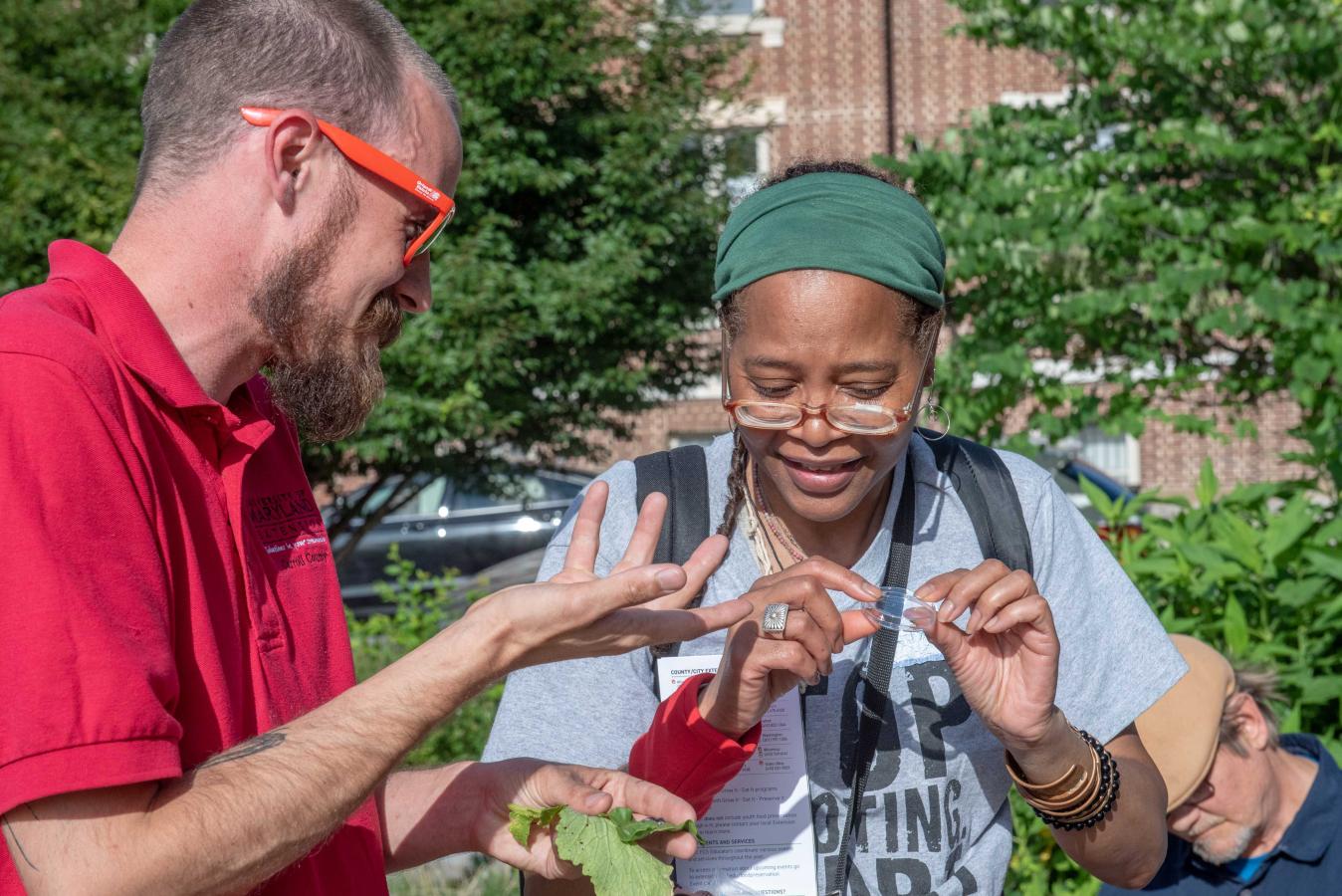 Extension employee helping a person out at an event